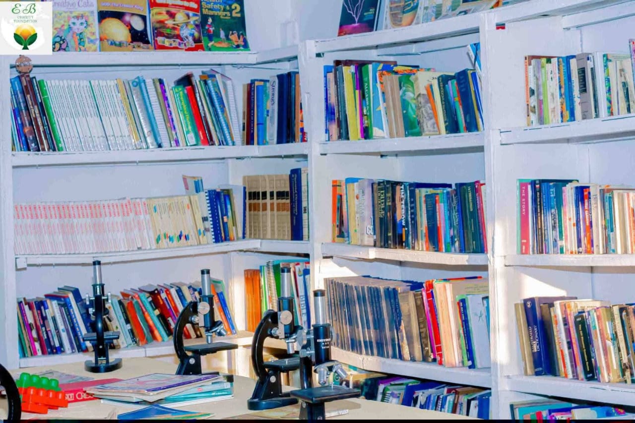Library learning corner with bookshelves and science equipment